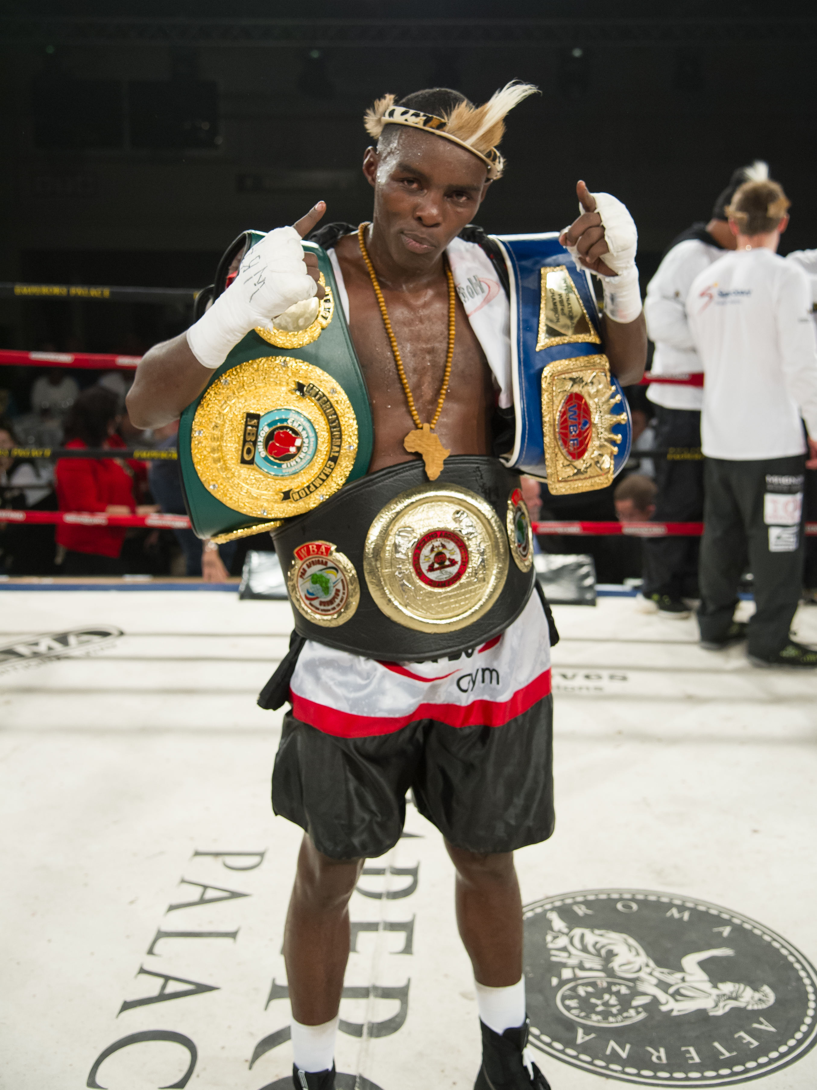 It was nip and tuck all night between Xolisani Ndongeni and Mzonke Fana, with the younger Ndongeni winning a razor-thin majority decision against the veteran former world champion in a scrap for the WBA Pan-African lightweight title – 115-113, 115-113, 114-114. The faster, busier Ndongeni, now unbeaten in 18 fights, just scraped home against the shrewd, sassy Fana. It was like a chess match between two contrasting styles: the unorthodoxy and youth of Ndongeni against the wiles and skills of the proud ex-champion. After an electric start, Ndongeni settled into an easy rhythm, but the trouble was he never quite asserted himself. He was over cautious and boxed within himself, presumably because he gave Fana too much respect. Even at 41 and with his best years behind him, Fana was in marvellous shape and fought with great ambition. Although he threw many punches, Ndongeni’s movement made him a difficult target and he either rode or avoided the many shots that came his way. It was a tremendous win for Ndongeni, his best to date, and he will have learned many important lessons. Perhaps the most significant moment of all came in the minutes after the fight as Fana warmly embraced and joked with his younger rival. It seemed like a symbolic passing of the baton from a proud old warrior to a proud younger one - D-DAY AT THE PALACE was promoted by Golden Gloves Boxing Promotions and was hosted by Emperors Palace, 6 June 2015.